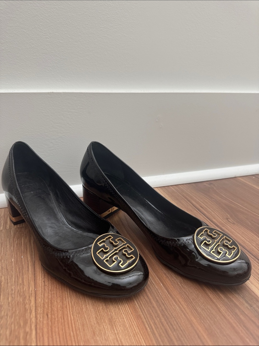 Tory Burch Black Patent Leather Block Heel Pumps with Gold Logo Medallion